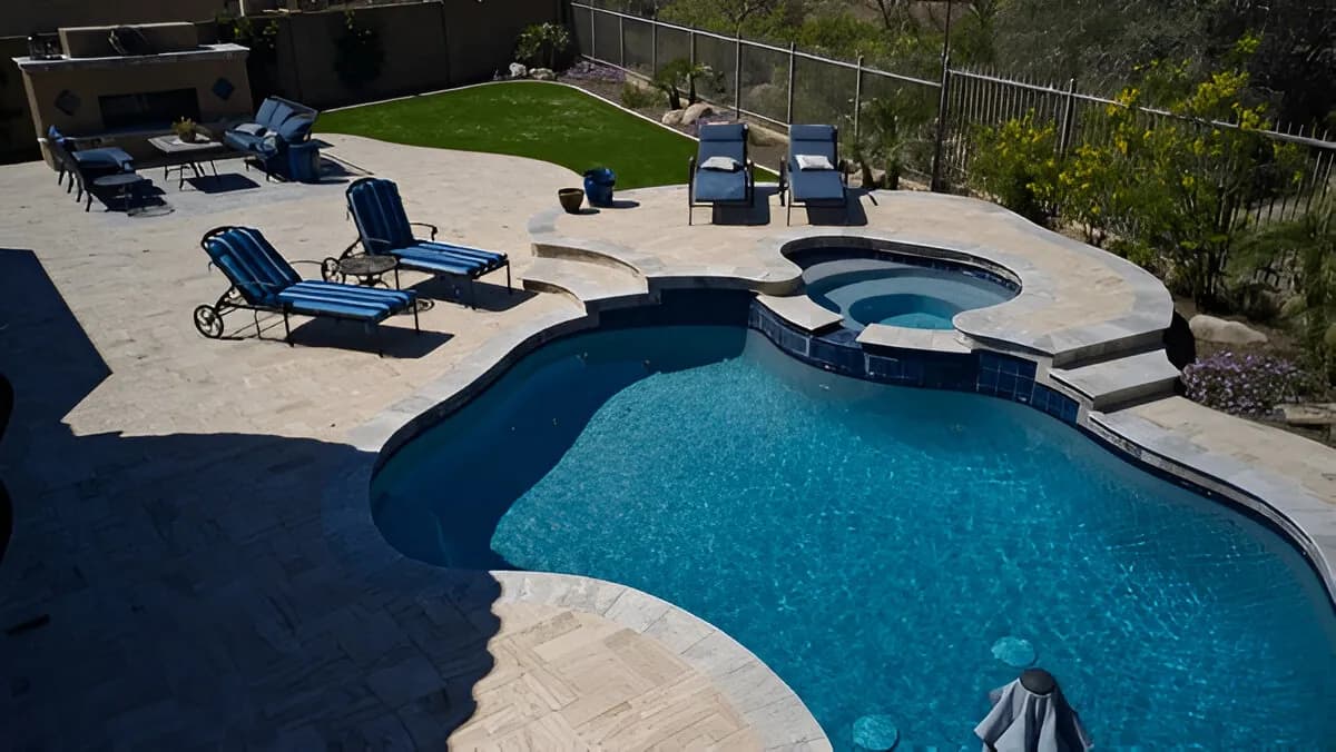 Quality Pools and Pavers team completing a backyard renovation in El Cajon
