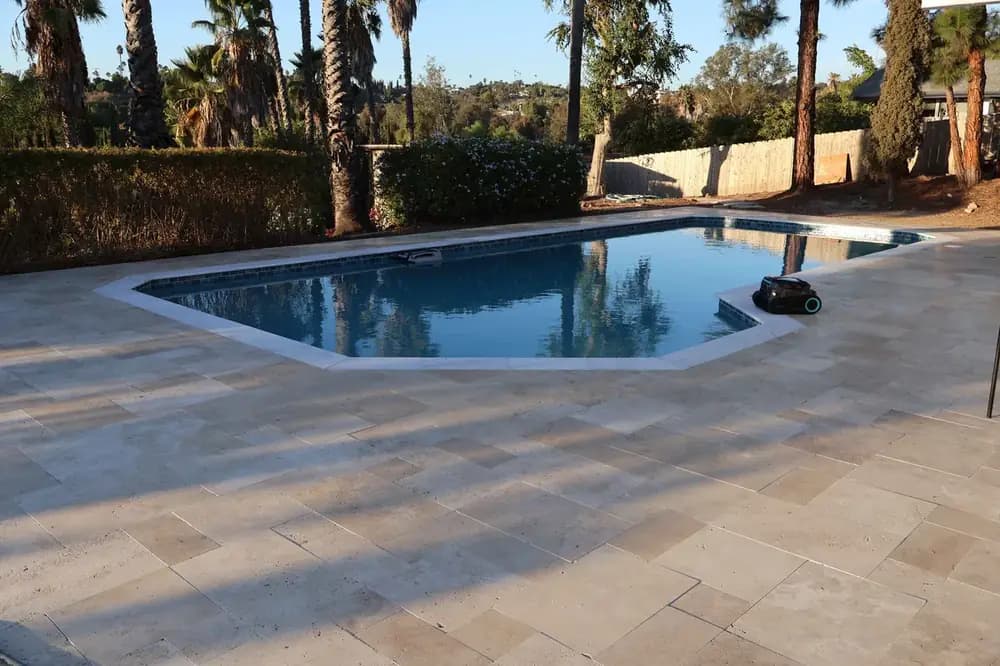 Pool deck paver installation with coping in San Diego