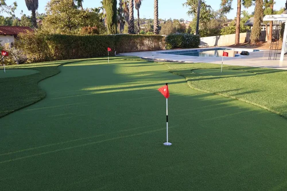 Artificial turf and paver combo backyard El Cajon